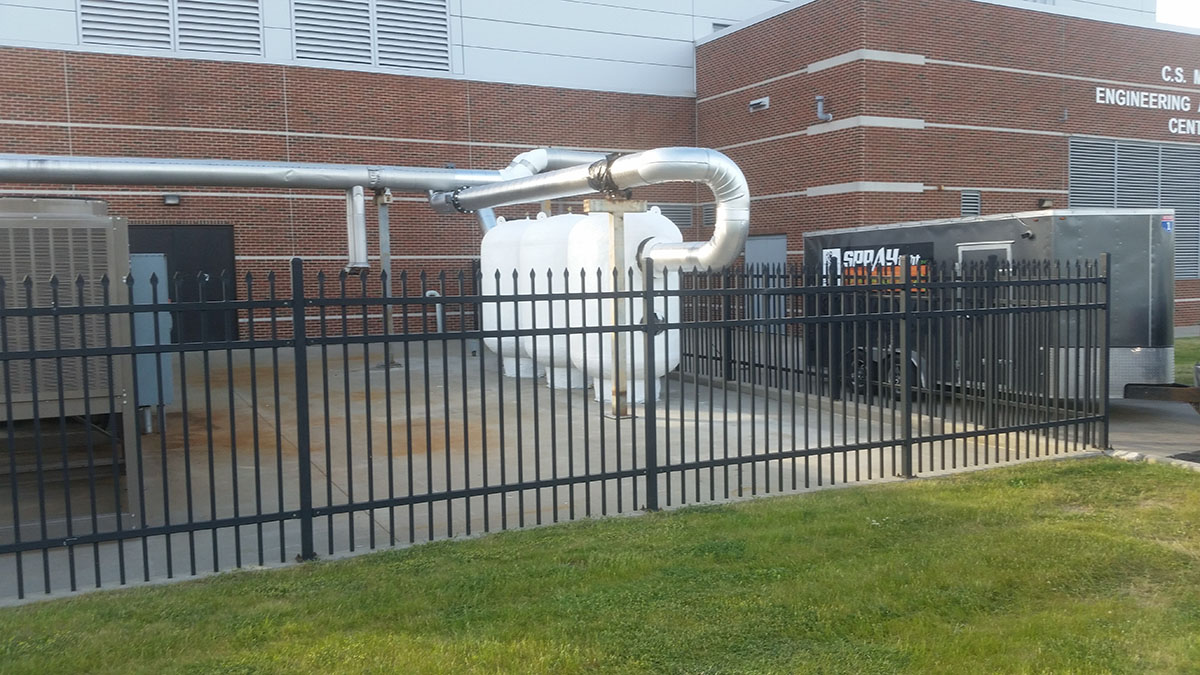 Spray polyurea waterproof coating on industrial gas tank in Michigan