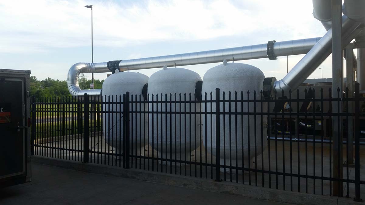 Spray polyurea coating on large propane containment tank in Michigan
